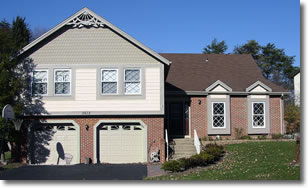 The 'after' picture, showing a house with renovated Certainteed vinyl siding