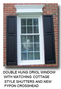 Picture of a Double hung oriol window with matching cottage style shutters and new Fypon crosshead